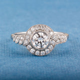 Round diamond cluster ring with spiral diamond shoulders