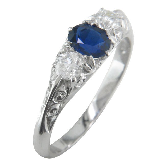 Sapphire carved half hoop ring in platinum