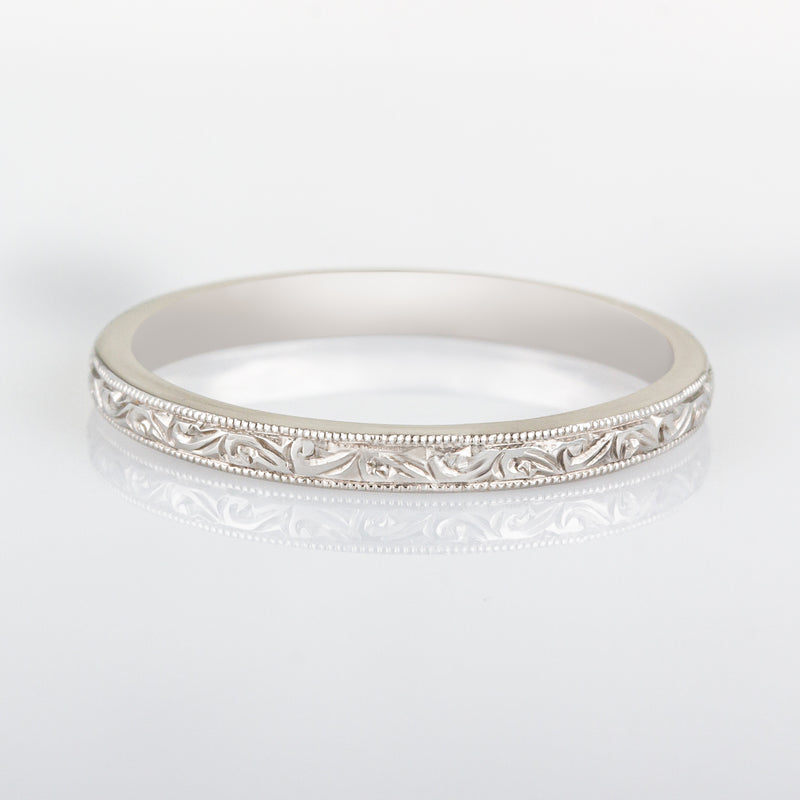 Scroll engraved wedding band in white gold