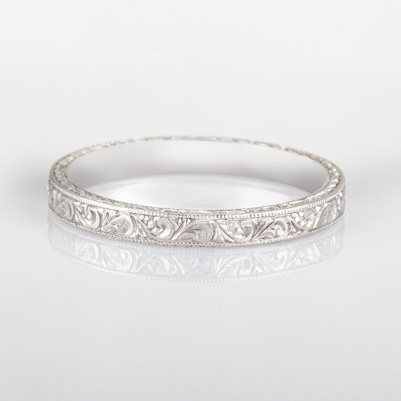 Scroll wedding ring in platinum and engraved