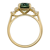 Teal sapphire ring with diamond trefoil in yellow gold