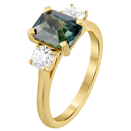Teal sapphire trilogy engagement ring in 18ct yellow gold
