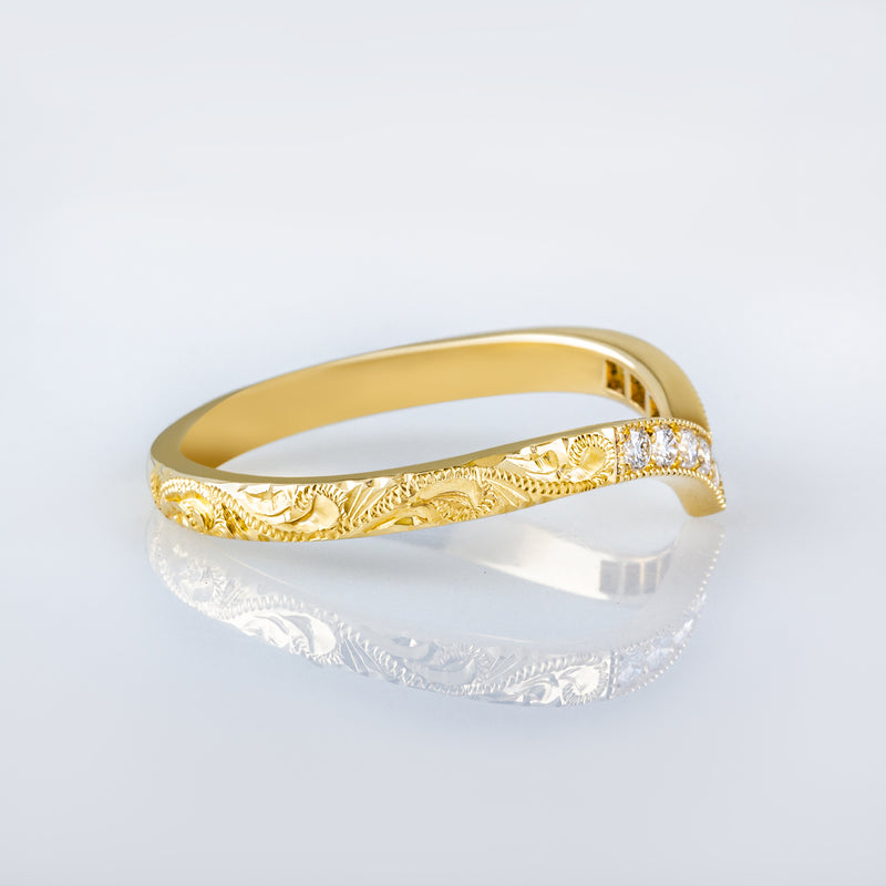 V-shape diamond wedding ring in gold hand engraved