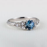 Vintage engraved aquamarine engagement ring in platinum
