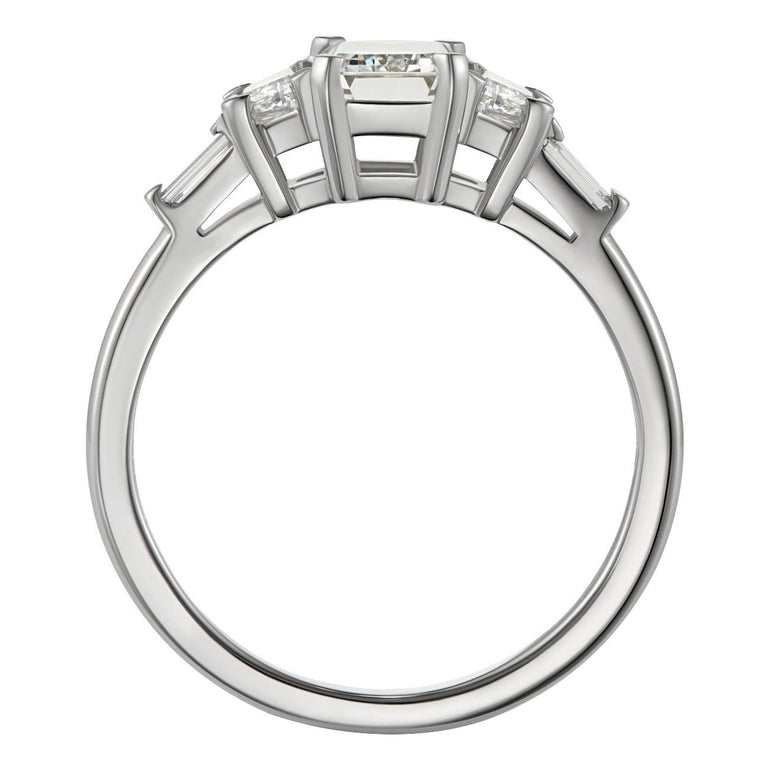 Vintage style emerald cut diamond ring in platinum with trapezoid baguette diamonds