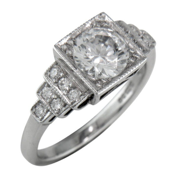 Vintage unusual lab grown diamond engagement ring with stepped shoulders in platinum