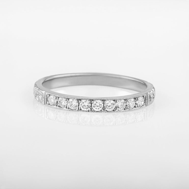 White gold diamond wedding ring engraved with paisley pattern