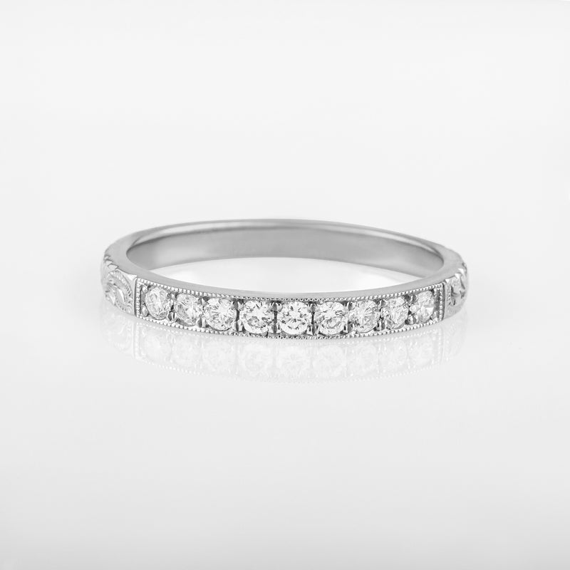 White gold diamond wedding ring engraved with paisley pattern