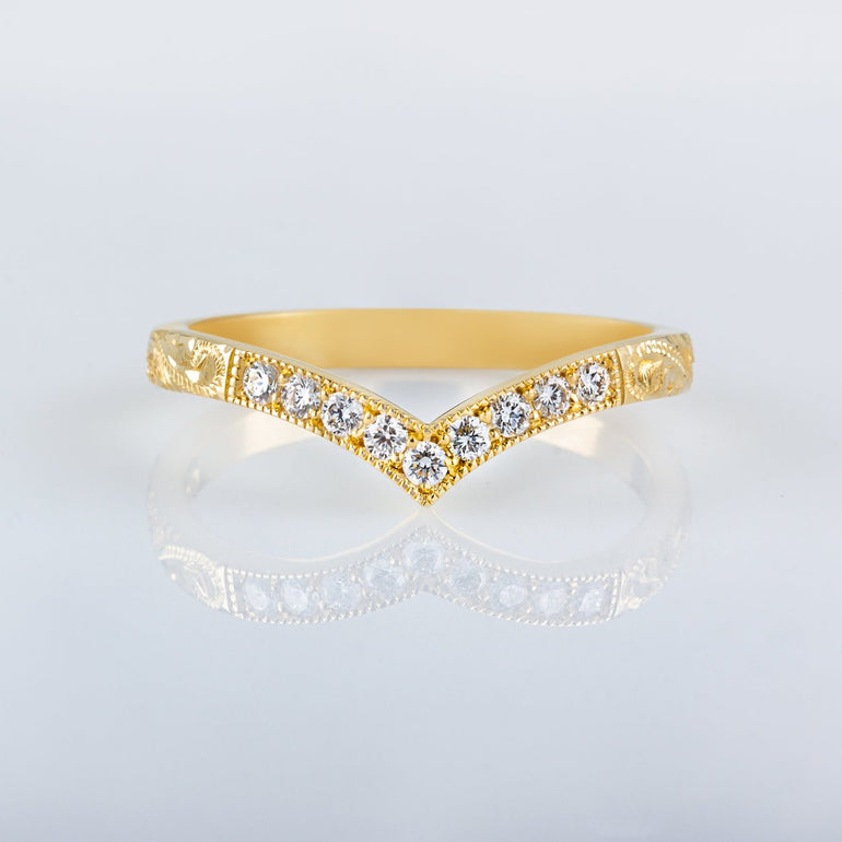 Diamond wishbone wedding ring in gold with engraved paisley pattern