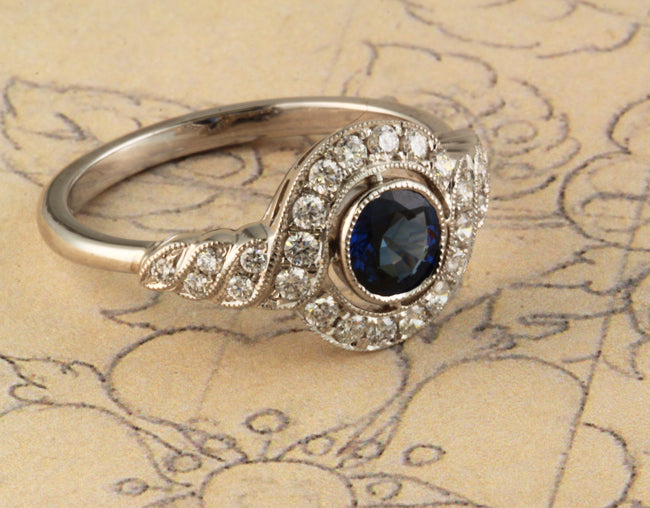 Sapphire cluster ring on vintage paper