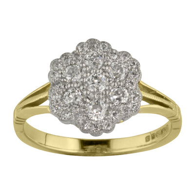 Antique style diamond cluster ring in platinum and yellow gold.