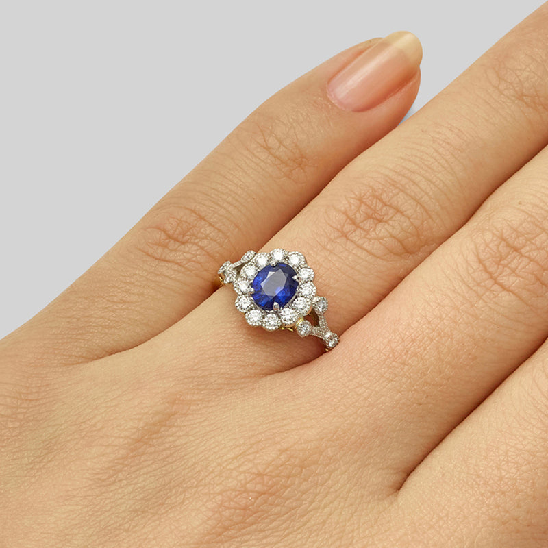 Antique oval cut sapphire and diamond ring in yellow gold and platinum