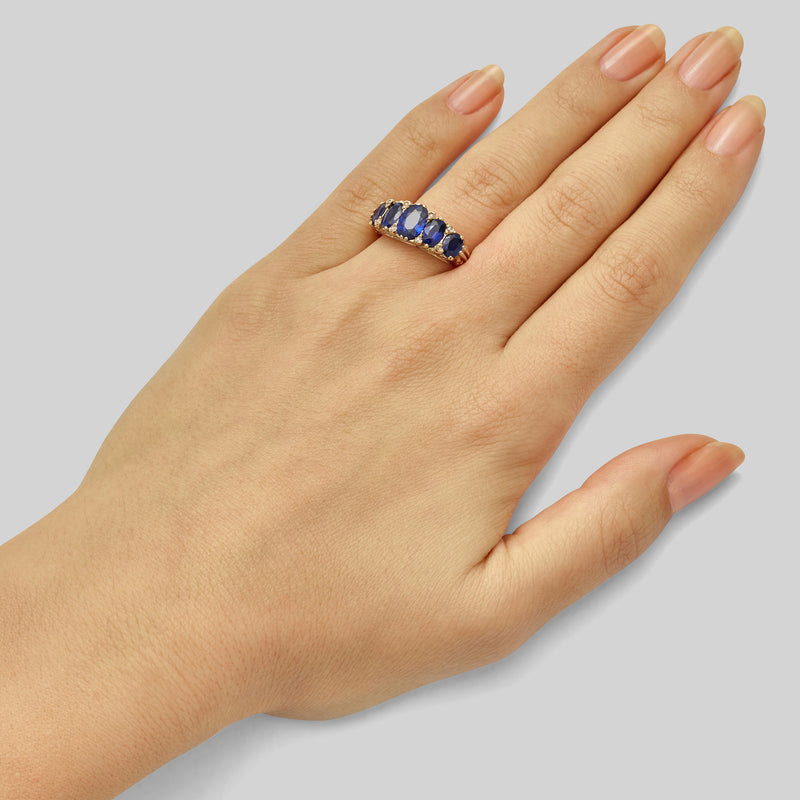 Five stone sapphire ring with diamonds set in gold