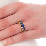 Antique style sapphire carved half hoop ring