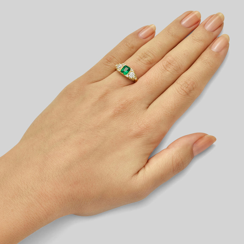 Vintage emerald and diamond ring in yellow gold