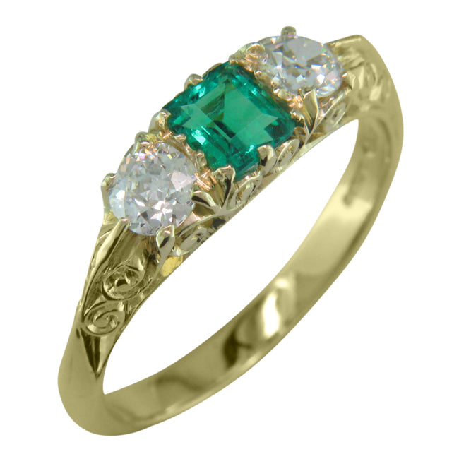 Emerald and diamond half hoop ring