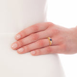 Victorian era sapphire engagement ring design on hand
