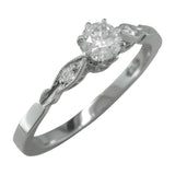 Dainty vintage style diamond engagement ring with diamond accent band