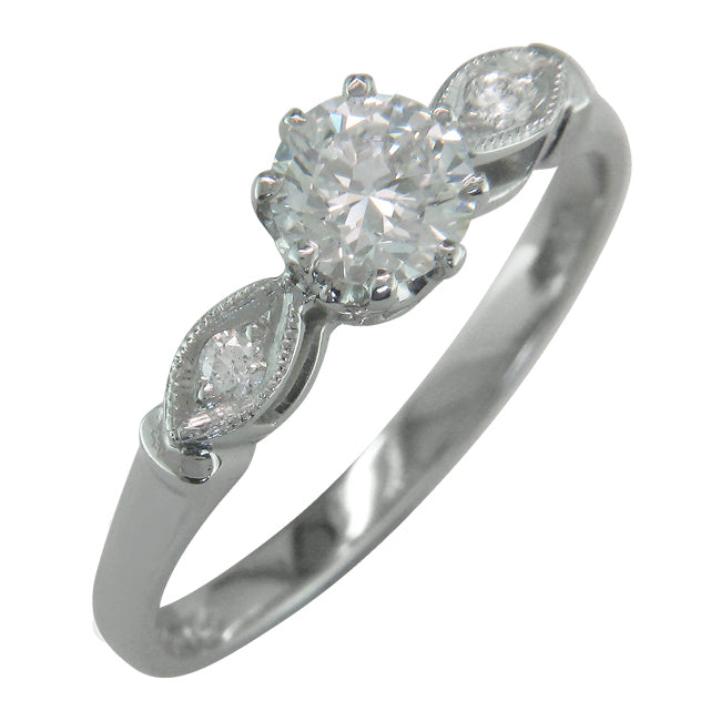 Vintage style engagement ring with milgrain edging and GIA diamond