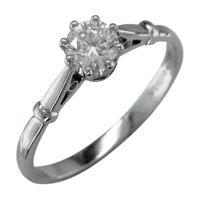 Slim band with certified diamond in an antique engagement ring design.
