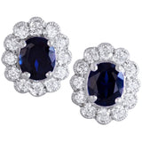 Oval sapphire and diamond cluster earrings in white gold