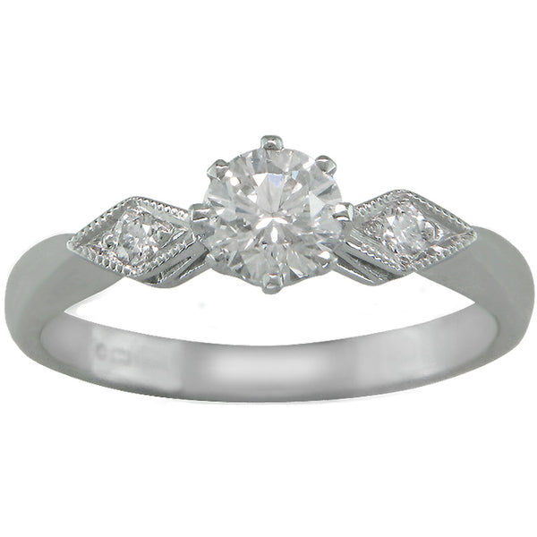 Art Deco style white gold ring with diamond-shape shoulders
