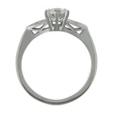 Diamond shaped shoulders in a 1930s style white gold ring.