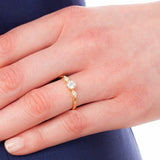 Yellow gold diamond ring on hand