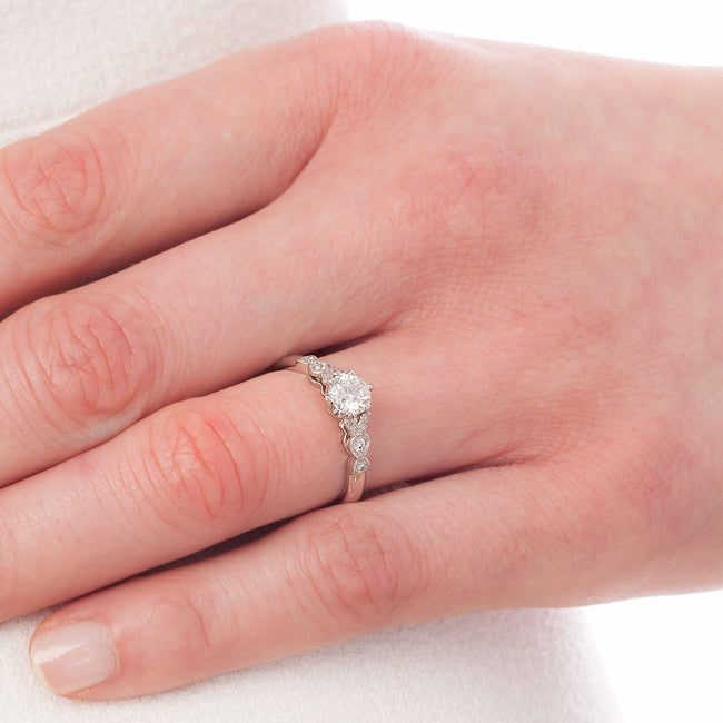 Edwardian style diamond ring on hand