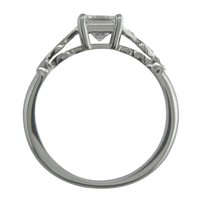 Princess cut vintage style diamond ring with diamond split shoulders.