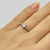 Vintage style diamond and side stone engagement ring