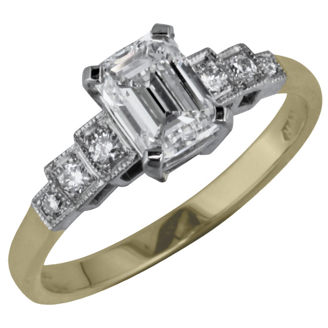 Emerald cut diamond ring with platinum top and yellow gold band