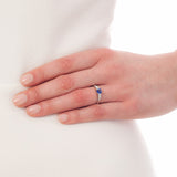 Sapphire engagement ring on hand
