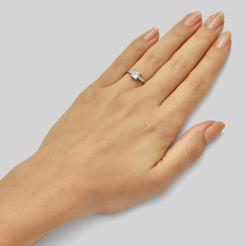 Princess cut ring with baguettes