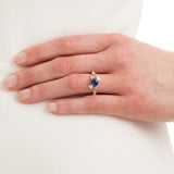 Sapphire flower ring with diamond leaves in yellow gold and platinum