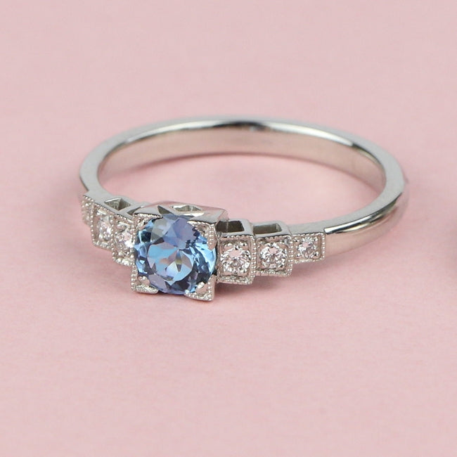 Aquamarine and diamond ring on paper