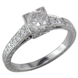 Engraved diamond and white gold engagement ring.