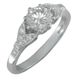 Antique engagement ring design with diamond-set floral motif