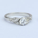 Unusual flower diamond engagement ring on paper