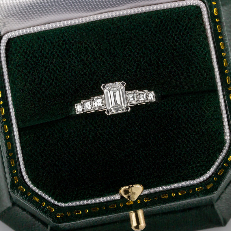 Emerald cut diamond ring in Art Deco design