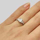 Art deco emerald cut diamond engagement ring with baguettes