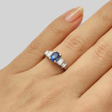 Vintage cushion cut blue sapphire ring with diamond baguettes