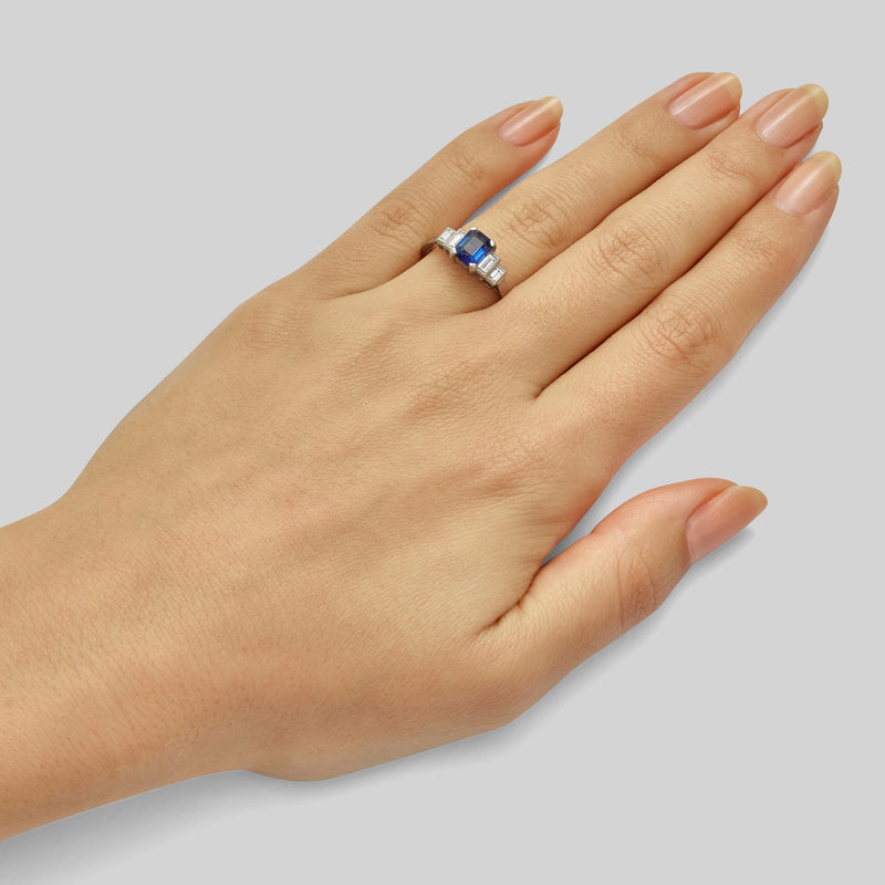 Five stone platinum sapphire ring with baguette diamonds