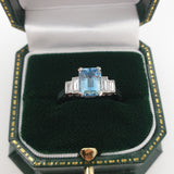 Aquamarine ring with baguette diamonds in box