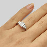 Emerald cut diamond engagement ring with baguettes in platinum