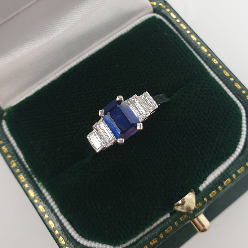 Emerald cut sapphire engagement ring in box