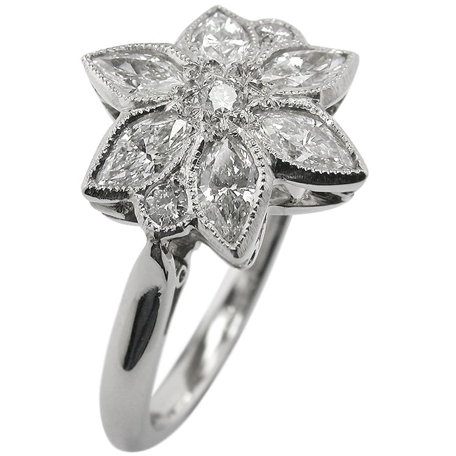 Diamond and platinum floral ring in UK.