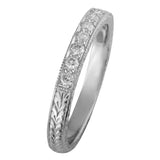 Engraved vintage wedding ring with diamonds in platinum