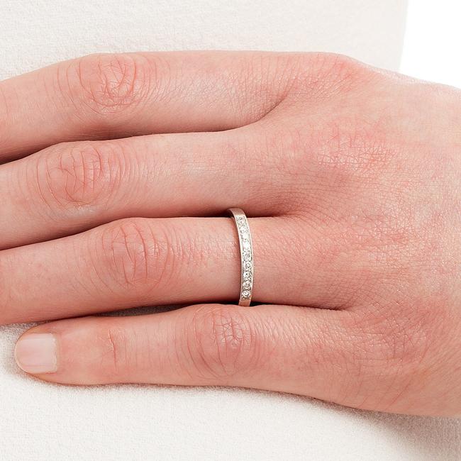 Traditional diamond wedding ring with milgrain on hand