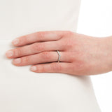 Diamond wishbone wedding ring in platinum on hand